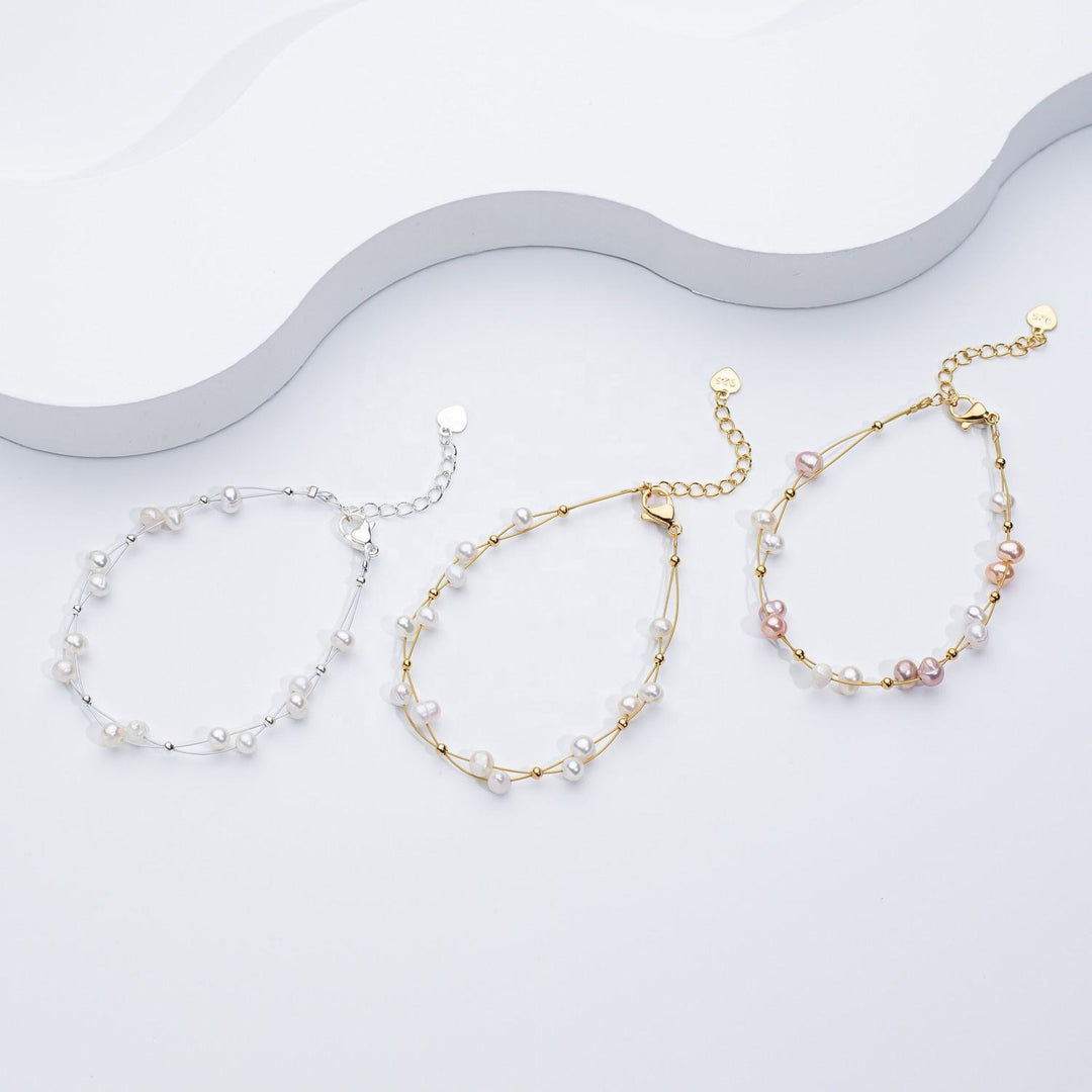 Marlena – Zlatý náramek s perlovými akcenty.