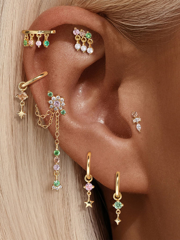 Nina – Malé zlaté náušnice s městským šarmem.