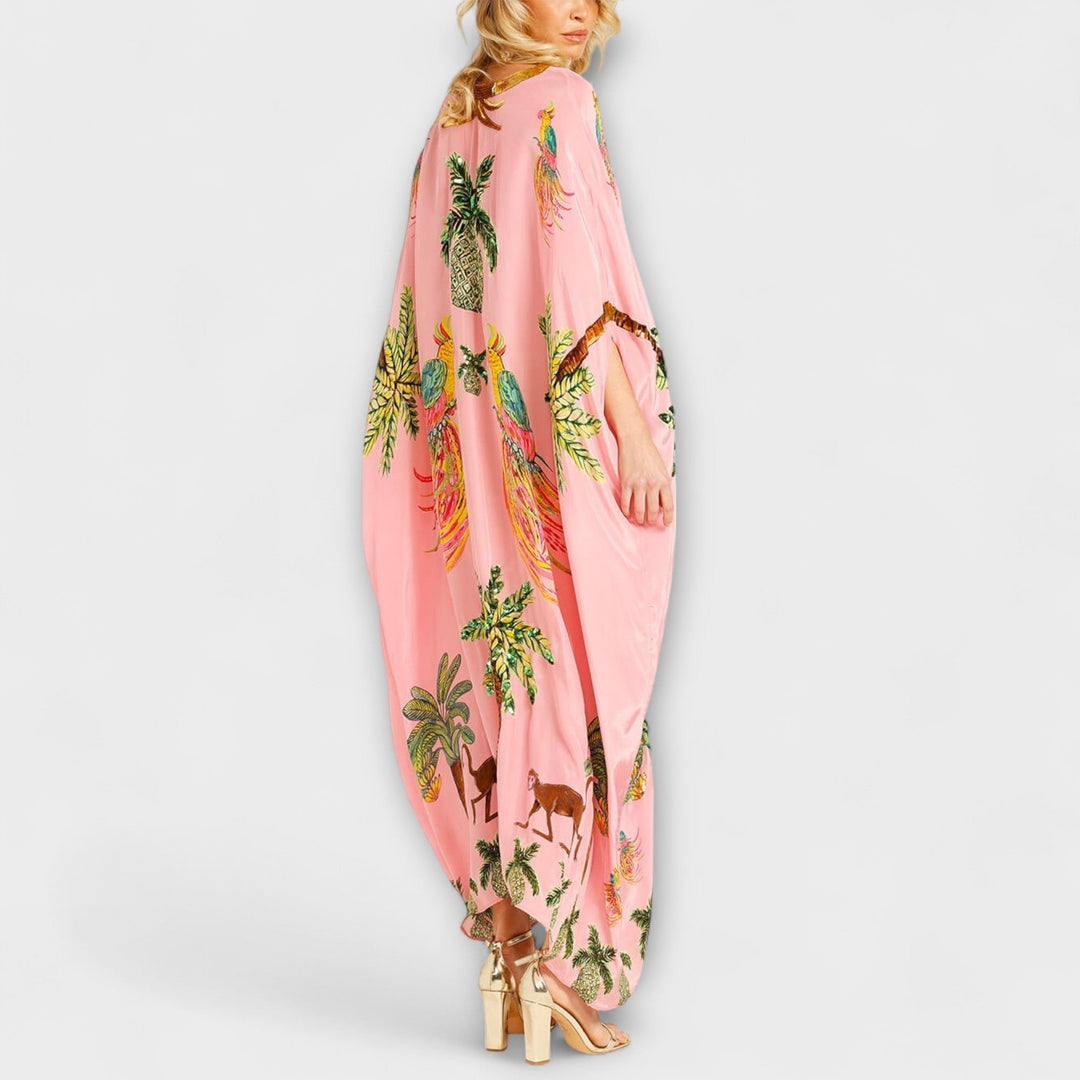 Linda - Působivé šaty s asymetrickými ramínky a potiskem kokosových palem